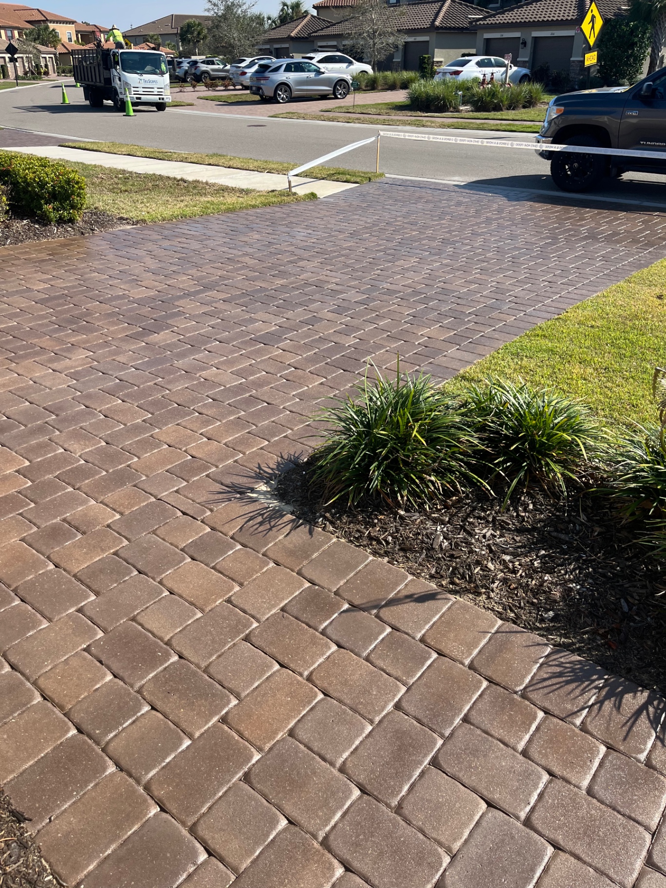 Freshly sealed paver driveway at a Country Club East home in Lakewood Ranch