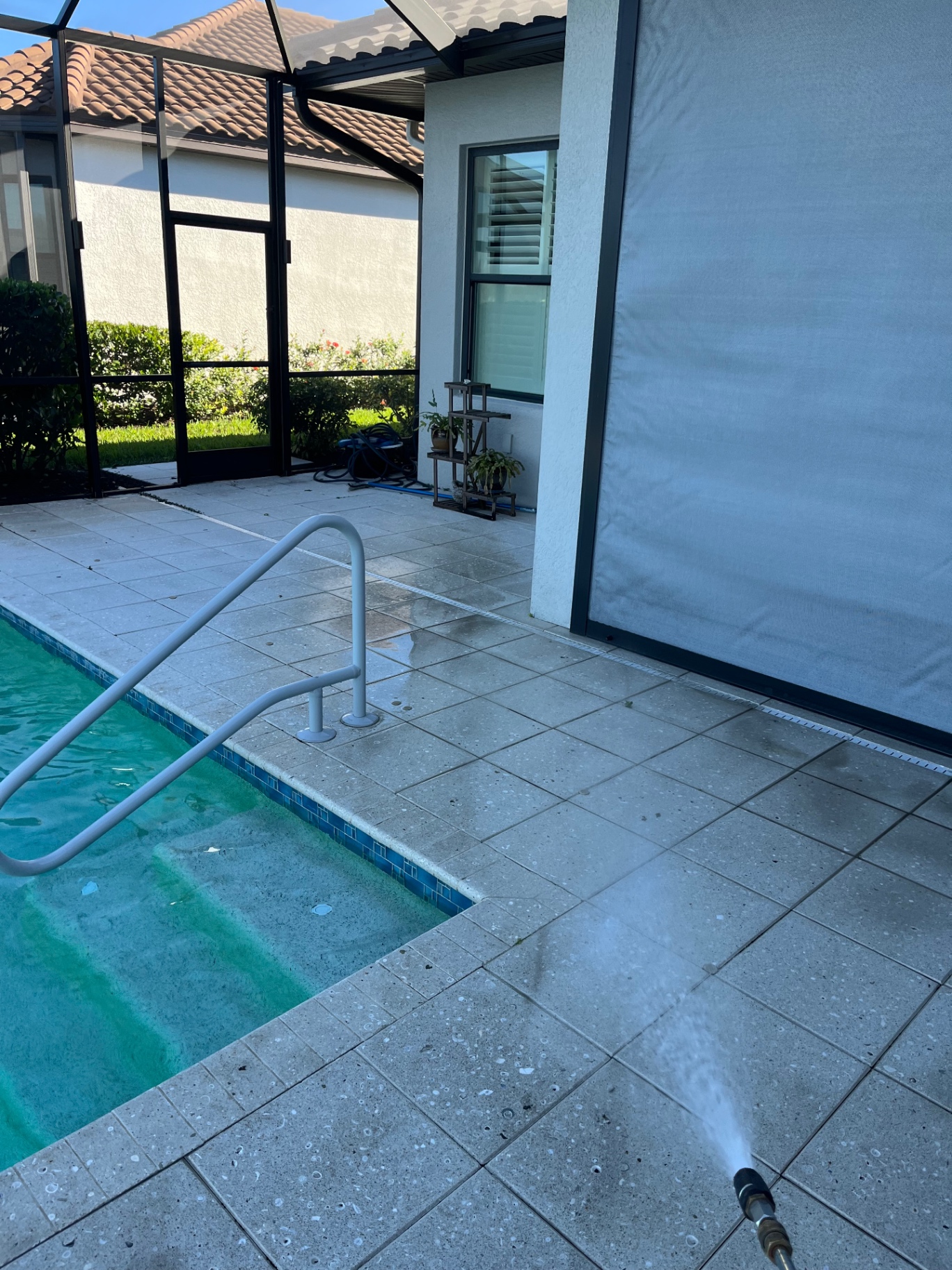 Pool deck cleaning at an Azario Esplanade Lakewood Ranch home