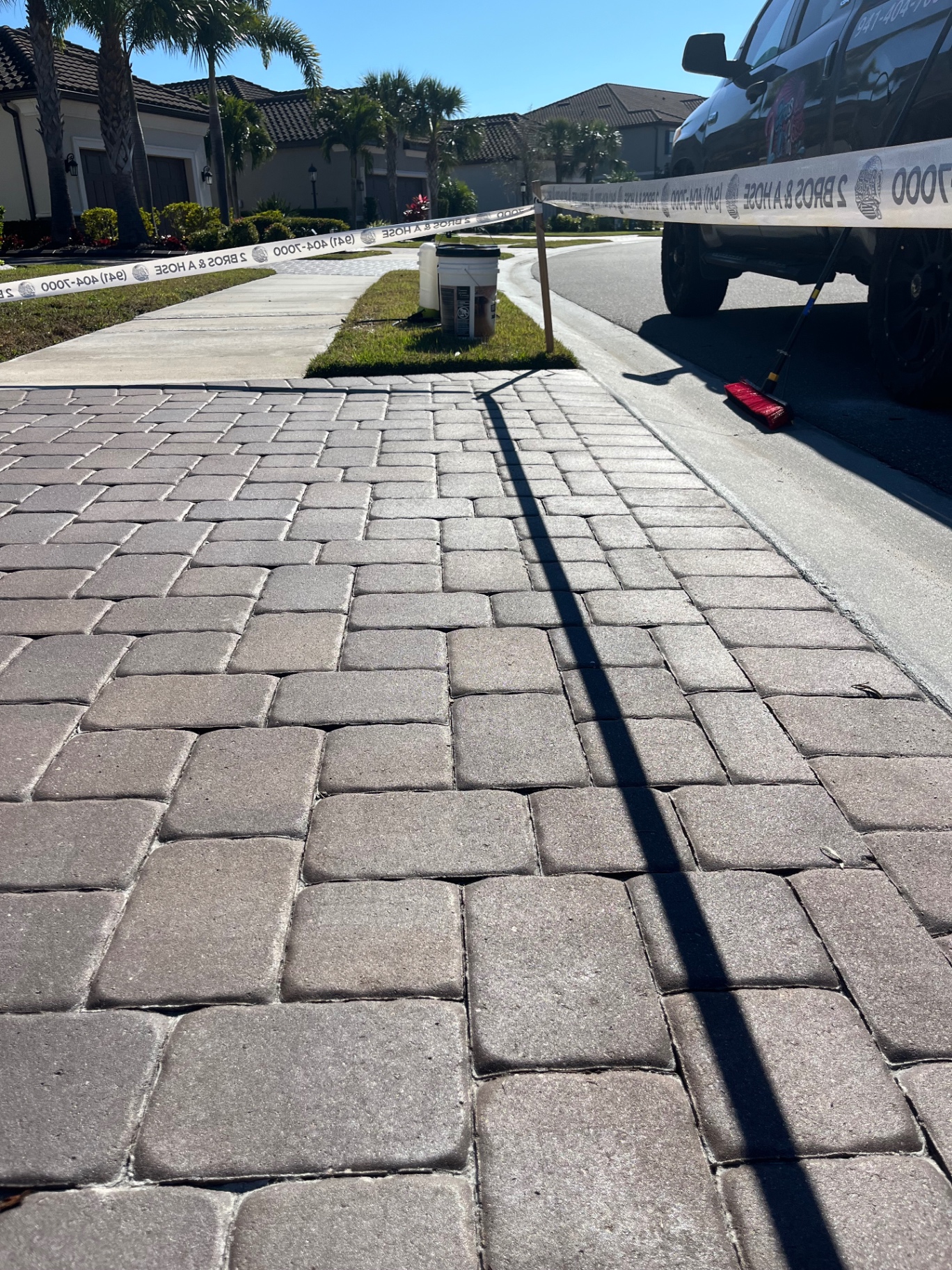 Dirty paver driveway before cleaning at a Country Club East home