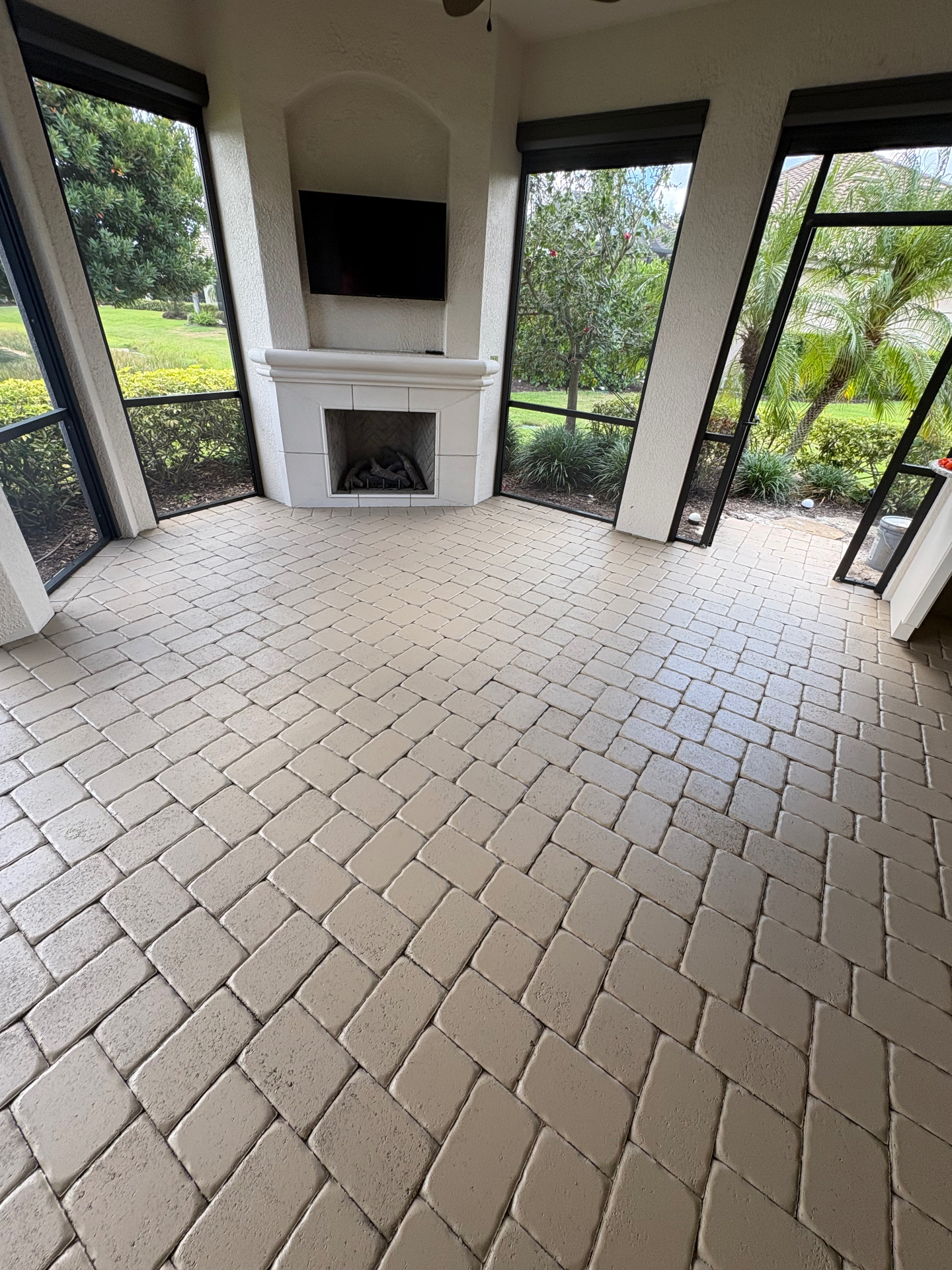 Cleaned lanai pavers and screen enclosure at an Esplanade Golf & Country Club home